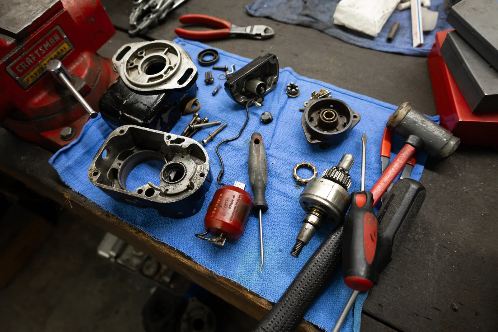 Disassembled engine components on the workbench