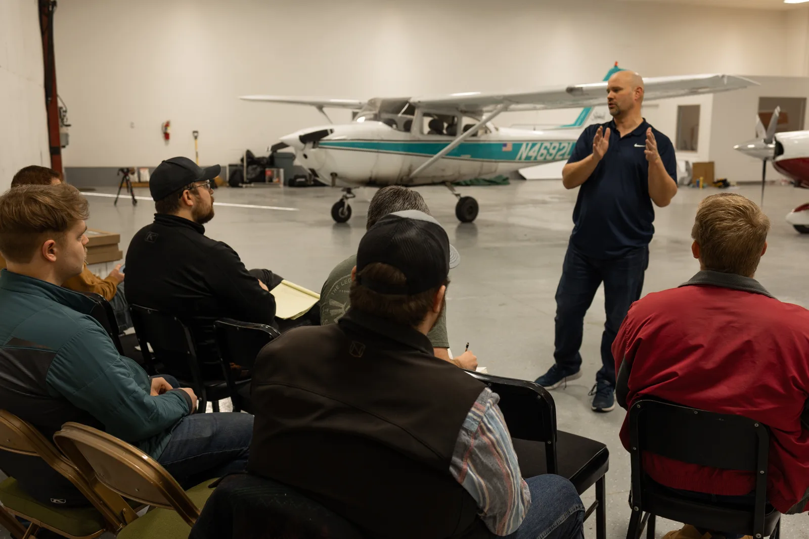 Instructor presenting at a Bravo 6 info session