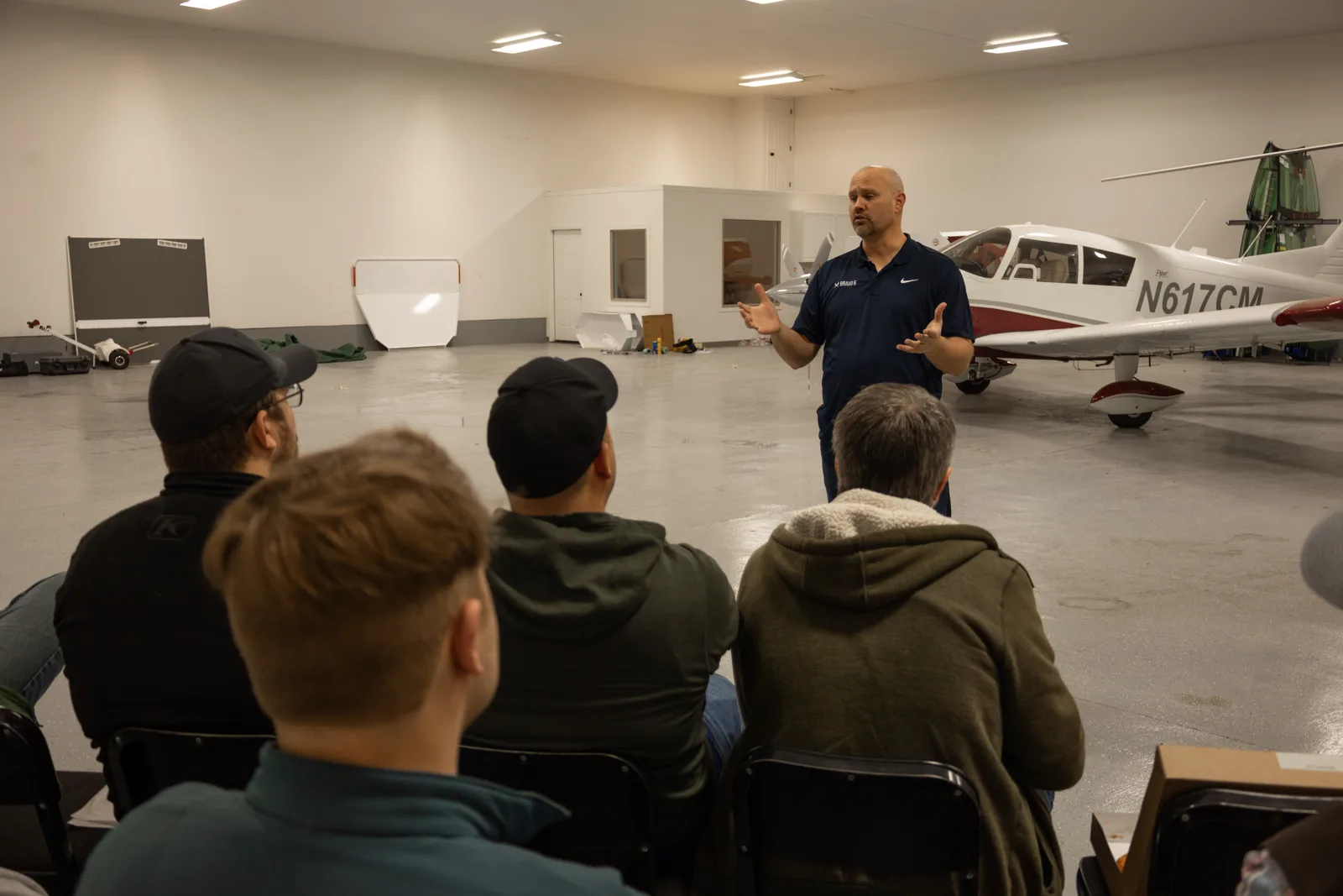 Wide view of the info session in the hangar
