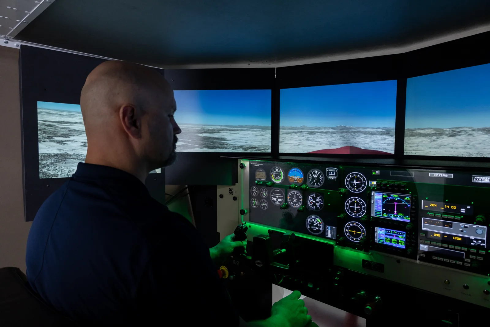 A pilot flying the Redbird simulator