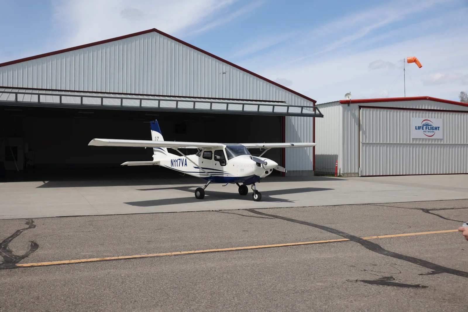Aircraft parked in the open hangar