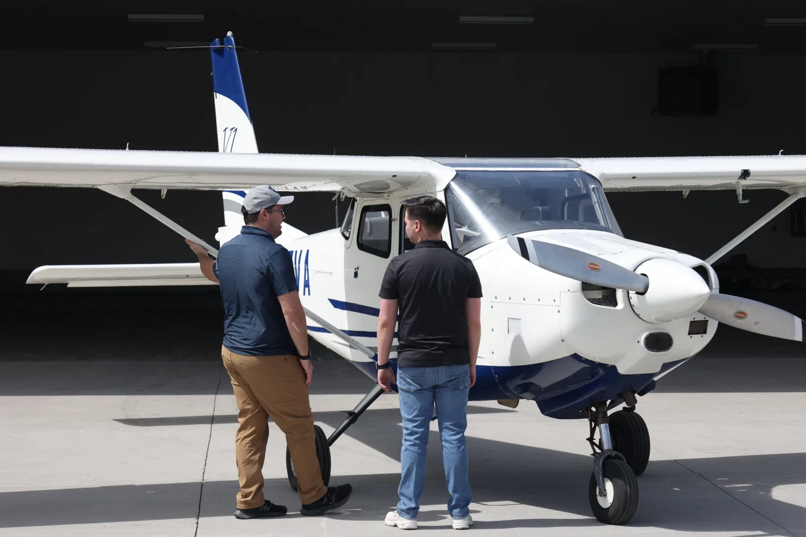 Instructor and student on a walk-around preflight