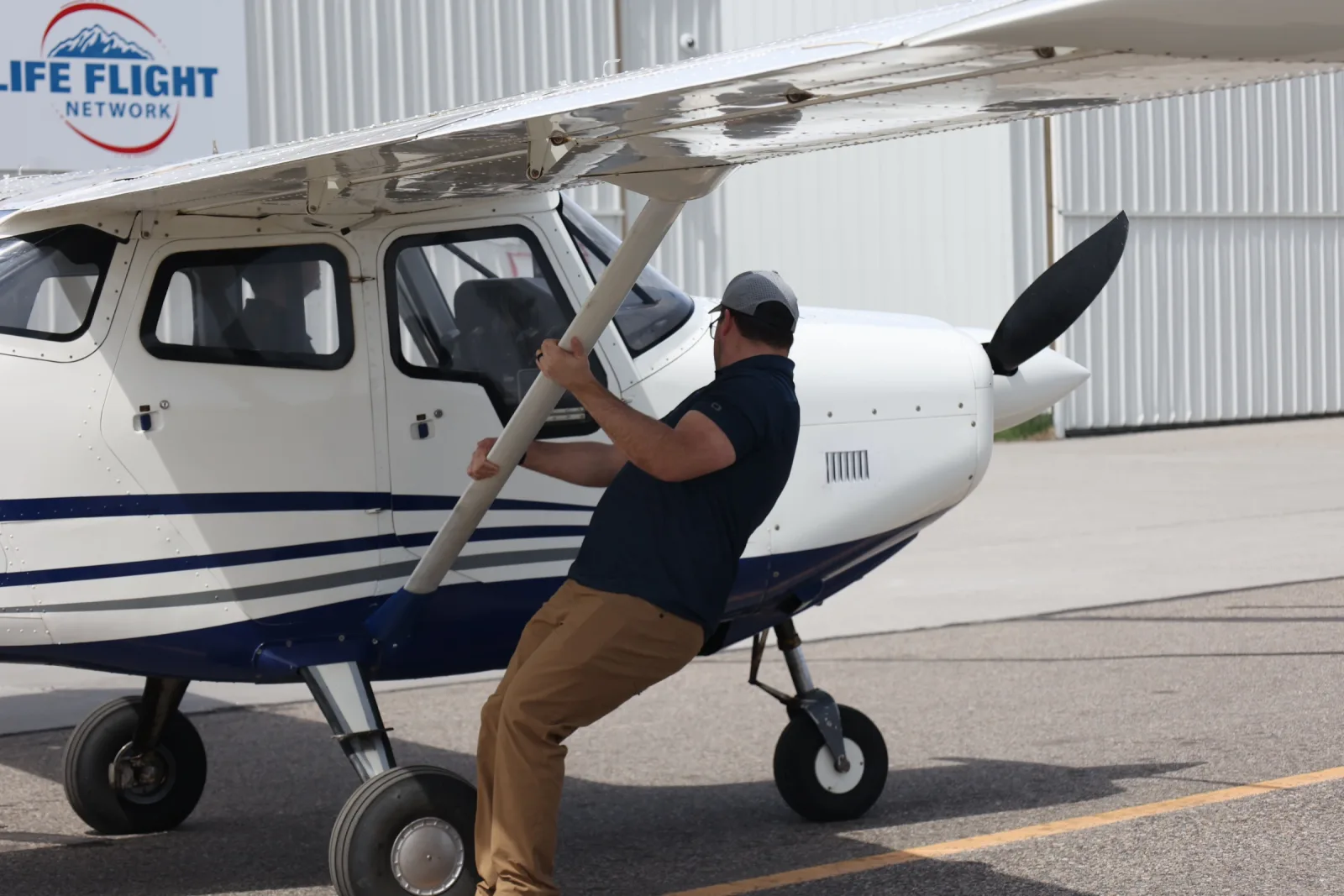 Hands on the propeller during preflight