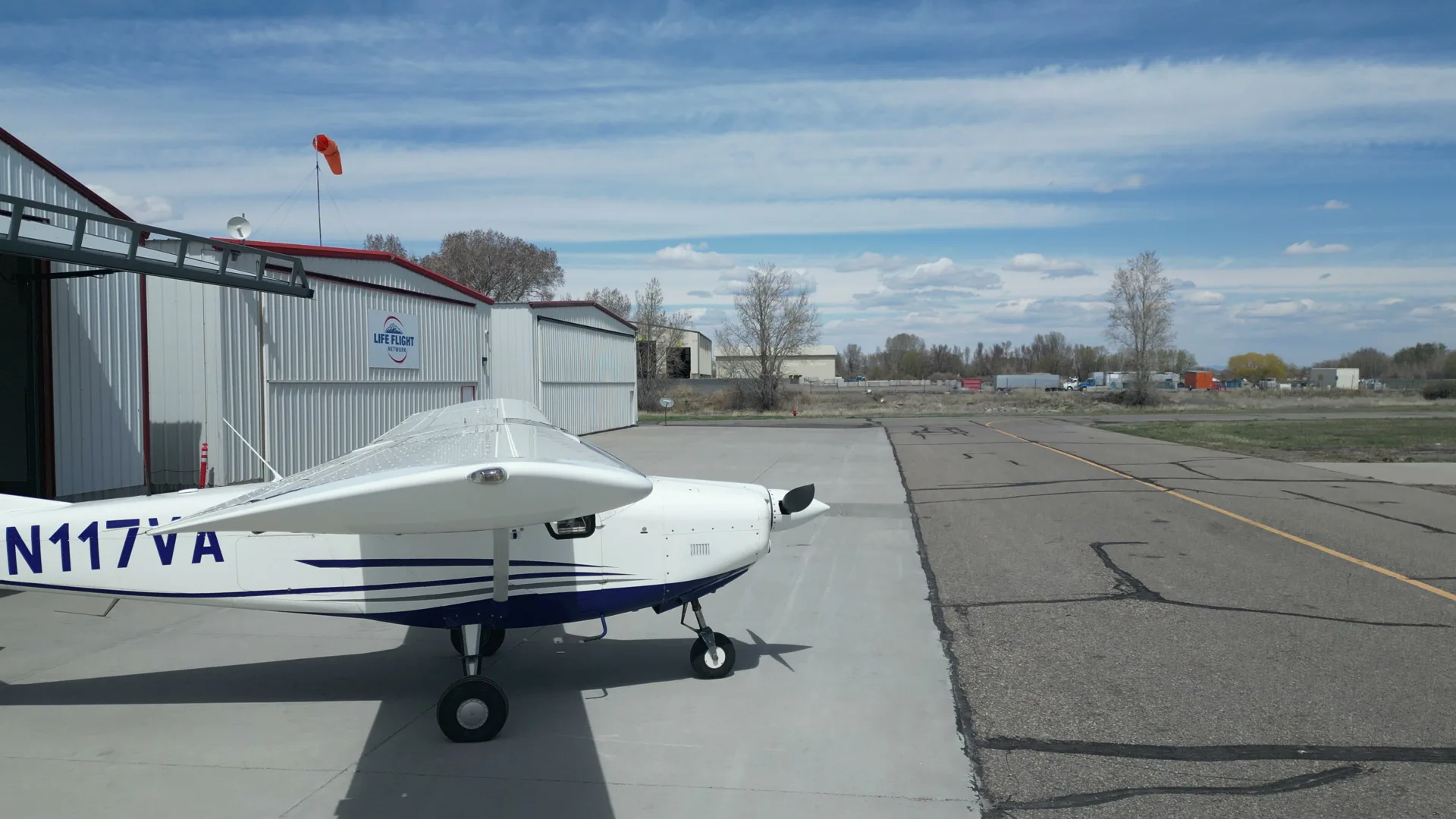Aerial of a Bravo 6 aircraft by the hangars and windsock