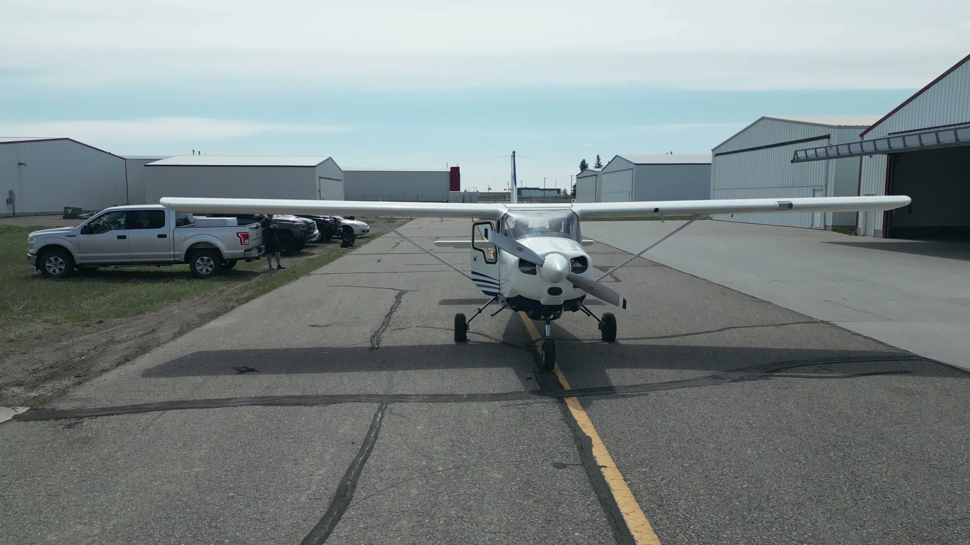 Aerial head-on of a Bravo 6 aircraft centered on the taxiway